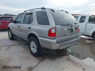 2004 Isuzu Rodeo S with VIN 4S2CK58W344311048, listed as a IAAI auction lot 41472392 with 128,732 mi miles. Bid and sale history available at carsss.com. Image 3.