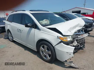 2012 Honda Odyssey Touring with VIN 5FNRL5H90CB067976, listed as a IAAI auction lot 42396236 with 161,070 mi miles and . Bid and sale history available at DreamBid. Image 1.