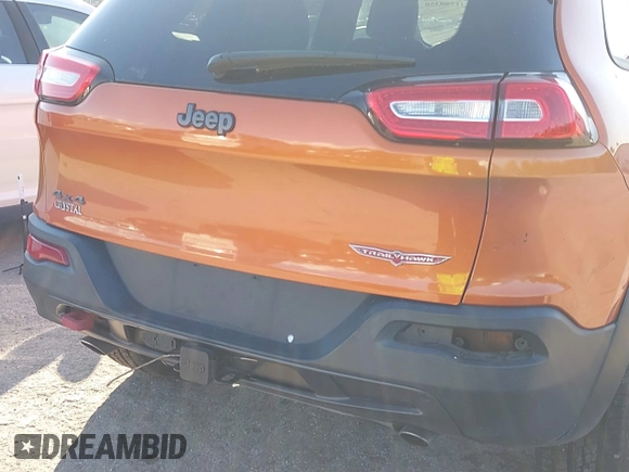 2014 Jeep Cherokee Trailhawk with VIN 1C4PJMBS4EW254879, listed as a IAAI auction lot 41550356 with 101,077 mi miles. Bid and sale history available at carsss.com. Image 21.