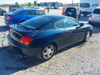 2003 Hyundai Tiburon GT z VIN KMHHN65FX3U076547, wystawiony jako IAAI lot #42015723 z przebiegiem 174 909 mil mil oraz . Historia ofert i sprzedaży dostępna na DreamBid. Obrazek 4.