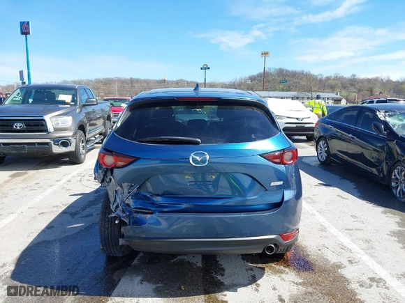 2019 Mazda CX-5 Touring with VIN JM3KFACM9K0686951, listed as a IAAI auction lot 41870797 with 66,303 mi miles. Bid and sale history available at carsss.com. Image 17.