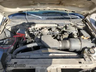 1999 Ford F-150 XL с VIN 1FTRF17L2XKA36749, выставлен на аукционе Copart как лот 84671444 с пробегом 148 338 миль миль и Списание • Salvage title. История ставок и продаж доступна на DreamBid. Изображение 11.