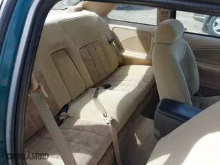 1997 Ford Thunderbird LX with VIN 1FALP62W7VH153454, listed as a IAAI auction lot 41833472 with 147,269 mi miles. Bid and sale history available at carsss.com. Image 8.