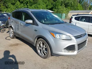2016 Ford Escape Titanium with VIN 1FMCU9J97GUB91966, listed as a IAAI auction lot 42378829 with 121,218 mi miles and . Bid and sale history available at DreamBid. Image 1.