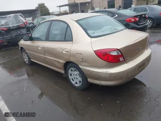 2002 Kia Rio with VIN KNADC123626192611, listed as a IAAI auction lot 41765104 with 62,387 mi miles. Bid and sale history available at carsss.com. Image 3.