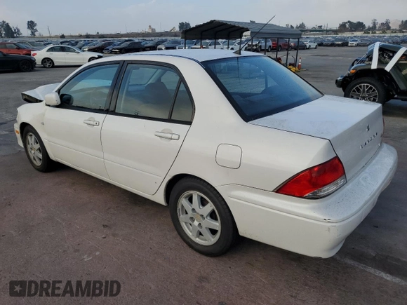 2002 Mitsubishi Lancer LS with VIN JA3AJ36E02U064779, listed as a Copart auction lot 86749184 with 127,343 mi miles and Salvage Title. Bid and sale history available at carsss.com. Image 2.