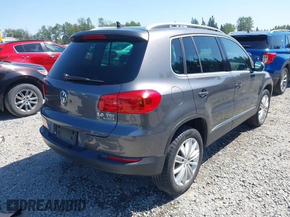 2013 Volkswagen Tiguan SEL with VIN WVGBV3AX1DW595673, listed as a IAAI auction lot 42140263 with 77,457 mi miles and . Bid and sale history available at DreamBid. Image 4.
