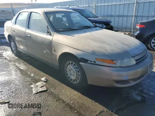 2001 Saturn LS z VIN 1G8JU52FX1Y552416, wystawiony jako Copart lot #41967165 z przebiegiem 196 403 mil mil oraz Szkody całkowita. Historia ofert i sprzedaży dostępna na DreamBid. Obrazek 4.