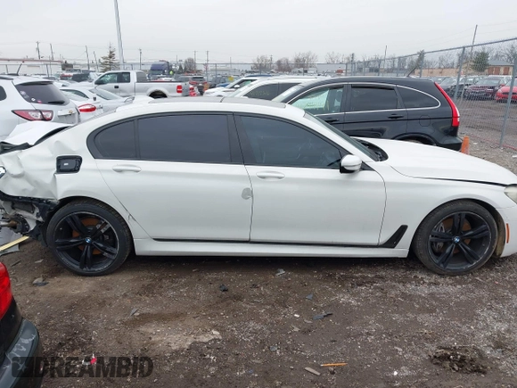 2016 BMW 7 Series 740i with VIN WBA7E2C50GG714647, listed as a IAAI auction lot 41745442 with 134,399 mi miles and . Bid and sale history available at carsss.com. Image 14.