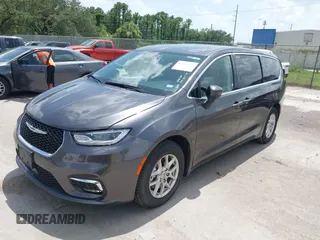 2023 Chrysler Pacifica Touring L with VIN 2C4RC1BG6PR590302, listed as a IAAI auction lot 42451369 with 72,097 mi miles and . Bid and sale history available at DreamBid. Image 2.