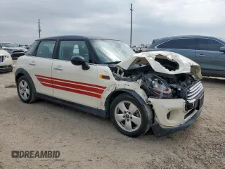 2015 MINI Hardtop 4 Door with VIN WMWXS5C51FT831167, listed as a Copart auction lot 52778685 with 52,770 mi miles and Salvage title. Bid and sale history available at DreamBid. Image 4.