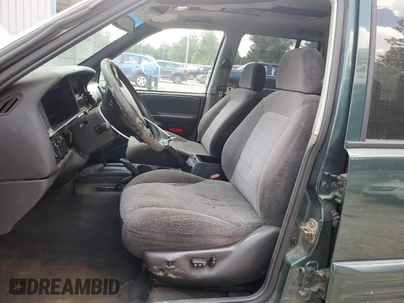 1998 Jeep Grand Cherokee Laredo with VIN 1J4GZ48S5WC289251, listed as a Copart auction lot 63594685 with 156,358 mi miles and Salvage title. Bid and sale history available at DreamBid. Image 7.
