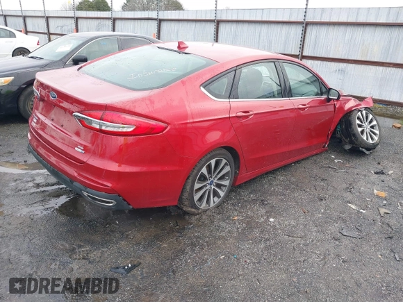 2020 Ford Fusion SE z VIN 3FA6P0T97LR234873, wystawiony jako IAAI lot #41510333 z przebiegiem 65 243 mil mil oraz . Historia ofert i sprzedaży dostępna na DreamBid. Obrazek 4.