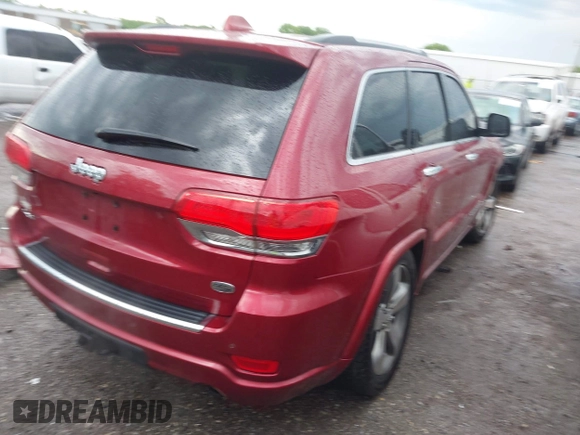 2014 Jeep Grand Cherokee Overland with VIN 1C4RJFCG9EC460165, listed as a IAAI auction lot 42092137 with 131,802 mi miles and . Bid and sale history available at DreamBid. Image 4.