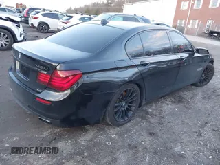 2015 BMW 7 Series 740Li xDrive with VIN WBAYF4C51FGS99074, listed as a IAAI auction lot 41222498 with 132,789 mi miles. Bid and sale history available at carsss.com. Image 4.