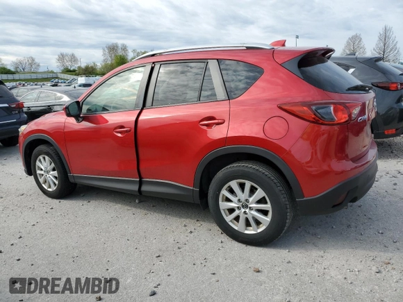 2014 Mazda CX-5 Touring with VIN JM3KE2CY6E0316041, listed as a Copart auction lot 52227835 with 69,921 mi miles and Salvage Title. Bid and sale history available at DreamBid. Image 2.