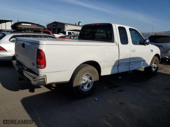 2003 Ford F-150 Work Series with VIN 2FTRX17WX3CA63767, listed as a Copart auction lot 84299684 with 165,719 mi miles and Salvage Title. Bid and sale history available at carsss.com. Image 3.