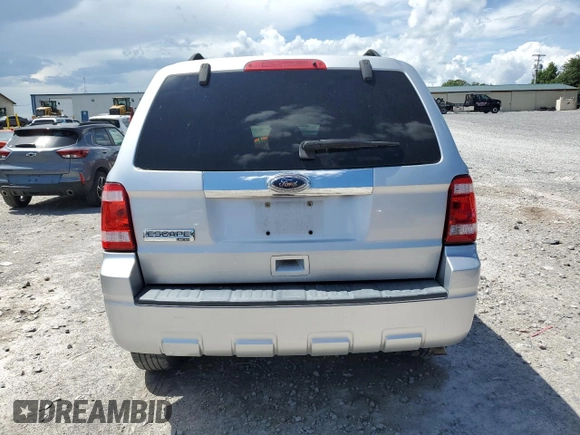2010 Ford Escape Limited with VIN 1FMCU0E77AKC58458, listed as a Copart auction lot 64207645 with 160,650 mi miles and Salvage title. Bid and sale history available at DreamBid. Image 6.