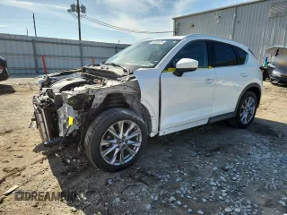 2019 Mazda CX-5 Grand Touring with VIN JM3KFBDM9K1631995, listed as a Copart auction lot 63099125 with 87,304 mi miles and Salvage title. Bid and sale history available at DreamBid. Image 1.