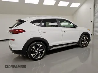2019 Hyundai Tucson Sport z VIN KM8J33AL3KU874095, wystawiony jako Copart lot #55959415 z przebiegiem 86 092 mil mil oraz Czysty tytuł • Clean title. Historia ofert i sprzedaży dostępna na DreamBid. Obrazek 3.