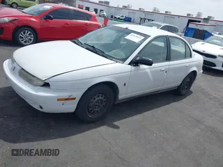 1998 Saturn SL z VIN 1G8ZJ5272WZ312413, wystawiony jako IAAI lot #41874493 z przebiegiem 229 200 mil mil oraz . Historia ofert i sprzedaży dostępna na DreamBid. Obrazek 12.