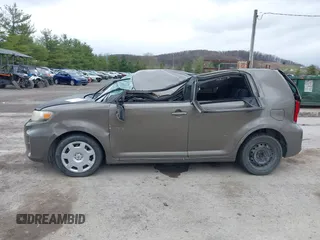 2014 Scion xB with VIN JTLZE4FE9EJ050596, listed as a IAAI auction lot 41884572 with 141,896 mi miles. Bid and sale history available at carsss.com. Image 14.
