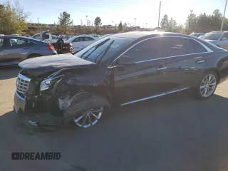 2014 Cadillac XTS Premium with VIN 2G61P5S35E9248233, listed as a Copart auction lot 81313374 with 122,751 mi miles and Salvage Title. Bid and sale history available at DreamBid. Image 1.