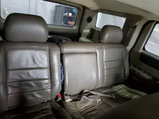 2003 Hummer H2 z VIN 5GRGN23U93H138182, wystawiony jako Copart lot #51842085 z przebiegiem 170 659 mil mil oraz Tytuł czysty. Historia ofert i sprzedaży dostępna na DreamBid. Obrazek 10.