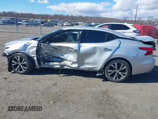 2016 Nissan Maxima SV z VIN 1N4AA6AP4GC446635, wystawiony jako IAAI lot #41672861 z przebiegiem 118 377 mil mil oraz . Historia ofert i sprzedaży dostępna na DreamBid. Obrazek 15.