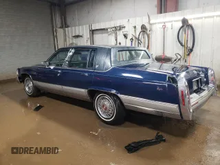 1990 Cadillac Brougham z VIN 1G6DW5474LR703771, wystawiony jako Copart lot #87653835 z przebiegiem 94 172 mil mil oraz Szkody całkowita. Historia ofert i sprzedaży dostępna na DreamBid. Obrazek 2.