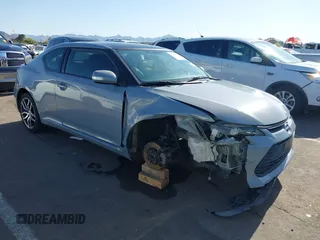 2015 Scion tC with VIN JTKJF5C7XFJ012872, listed as a IAAI auction lot 42128621 with 100,832 mi miles. Bid and sale history available at carsss.com. Image 1.