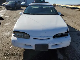1994 Ford Thunderbird LX with VIN 1FALP62WXRH217279, listed as a Copart auction lot 80512504 with 176,798 mi miles and Salvage Title. Bid and sale history available at DreamBid. Image 5.