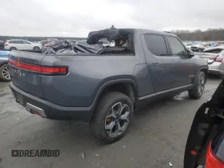 2022 Rivian R1T Adventure z VIN 7FCTGAAA5NN014020, wystawiony jako Copart lot #81367764 z przebiegiem Nie podano mil oraz Szkody całkowita. Historia ofert i sprzedaży dostępna na DreamBid. Obrazek 3.