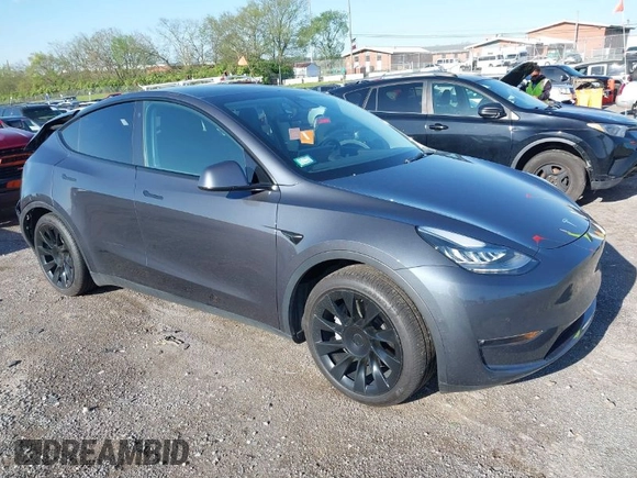2021 Tesla Model Y Long Range with VIN 5YJYGAEE1MF149887, listed as a IAAI auction lot 42032104 with 54,932 mi miles. Bid and sale history available at carsss.com. Image 1.