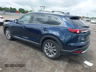 2020 Mazda CX-9 Grand Touring with VIN JM3TCBDY1L0402718, listed as a IAAI auction lot 42355511 with 87,205 mi miles and . Bid and sale history available at DreamBid. Image 3.