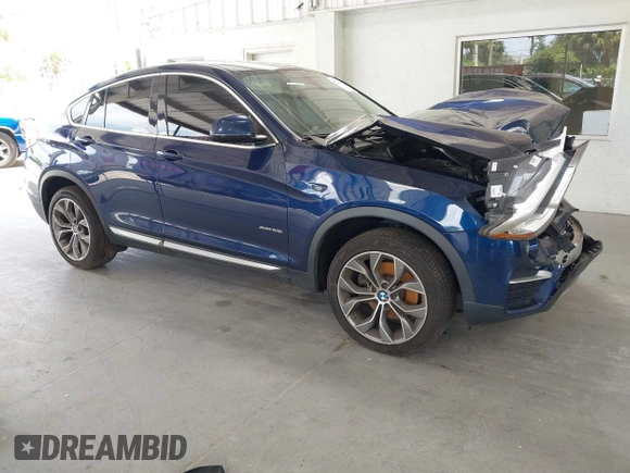 2015 BMW X4 xDrive28i with VIN 5UXXW3C51F0M87268, listed as a IAAI auction lot 42366363 with 143,285 mi miles and . Bid and sale history available at DreamBid. Image 1.