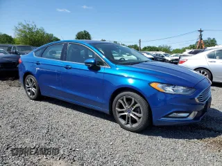 2017 Ford Fusion SE z VIN 3FA6P0T9XHR303675, wystawiony jako Copart lot #57134985 z przebiegiem 130 964 mil mil oraz Tytuł czysty. Historia ofert i sprzedaży dostępna na DreamBid. Obrazek 4.