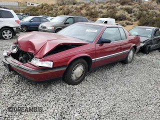 1992 Cadillac Eldorado z VIN 1G6EL13B2NU618200, wystawiony jako Copart lot #71774244 z przebiegiem 114 202 mil mil oraz Szkoda całkowita • Salvage title. Historia ofert i sprzedaży dostępna na DreamBid. Obrazek 1.