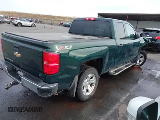 2014 Chevrolet Silverado 1500 LT with VIN 1GCVKREC7EZ312679, listed as a IAAI auction lot 40874395 with 153,234 mi miles and . Bid and sale history available at DreamBid. Image 4.