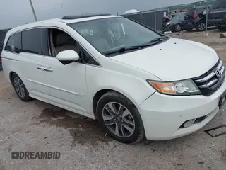2014 Honda Odyssey Touring with VIN 5FNRL5H98EB117932, listed as a IAAI auction lot 42300740 with 135,278 mi miles and . Bid and sale history available at DreamBid. Image 1.