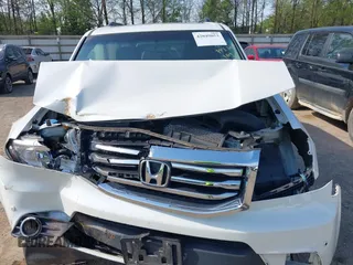 2013 Honda Pilot Touring with VIN 5FNYF3H92DB034731, listed as a IAAI auction lot 42049853 with 127,278 mi miles and . Bid and sale history available at DreamBid. Image 6.