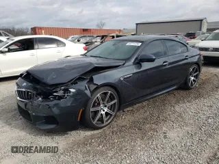 2016 BMW M6 z VIN WBS6E9C59GG437111, wystawiony jako Copart lot #44711734 z przebiegiem 79 471 mil mil oraz . Historia ofert i sprzedaży dostępna na DreamBid. Obrazek 1.