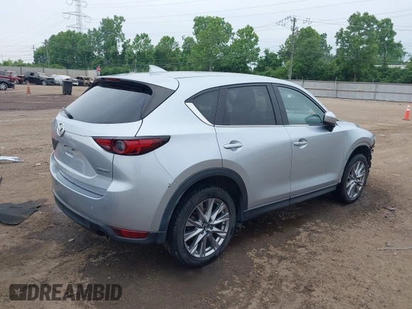 2021 Mazda CX-5 Grand Touring with VIN JM3KFBDM4M0371496, listed as a IAAI auction lot 42428860 with 113,735 mi miles and . Bid and sale history available at DreamBid. Image 4.