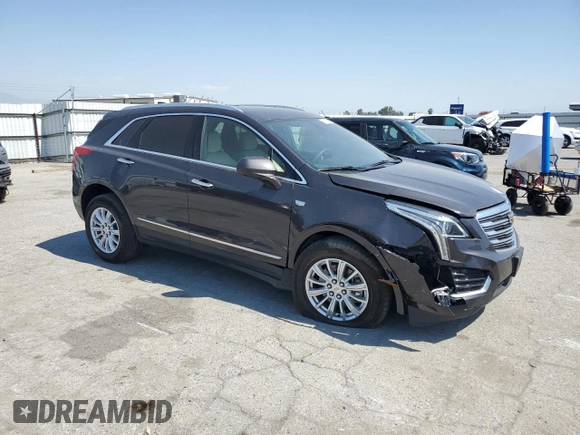 2018 Cadillac XT5 FWD with VIN 1GYKNARS5JZ155879, listed as a Copart auction lot 59568525 with 88,376 mi miles and Salvage title. Bid and sale history available at DreamBid. Image 4.