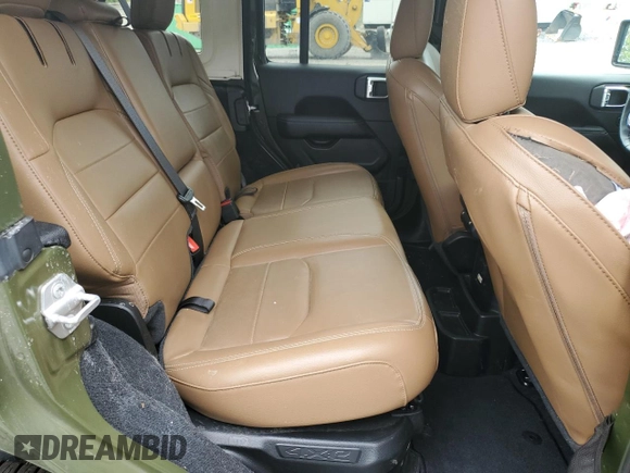 2023 Jeep Wrangler Sahara z VIN 1C4JJXP62PW553101, wystawiony jako Copart lot #56935165 z przebiegiem 28 157 mil mil oraz Szkoda całkowita • Salvage title. Historia ofert i sprzedaży dostępna na DreamBid. Obrazek 10.