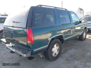 1997 Chevrolet Tahoe with VIN 1GNEK13RXVJ375189, listed as a IAAI auction lot 41959601 with 153,589 mi miles. Bid and sale history available at carsss.com. Image 4.