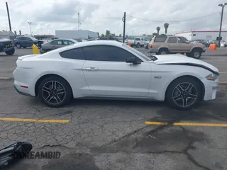 2021 Ford Mustang GT with VIN 1FA6P8CF5M5115597, listed as a IAAI auction lot 42142619 with 101,687 mi miles and . Bid and sale history available at DreamBid. Image 12.