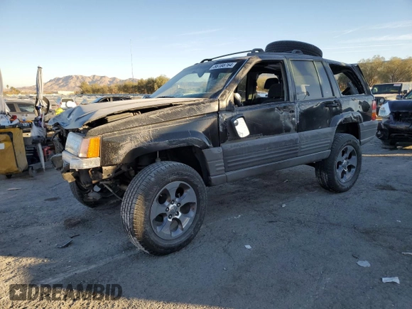 1998 Jeep Grand Cherokee Laredo with VIN 1J4FX58S4WC102623, listed as a Copart auction lot 86188764 with 283,210 mi miles and Salvage Title. Bid and sale history available at carsss.com. Image 1.
