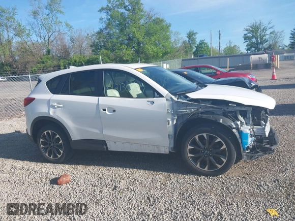 2016 Mazda CX-5 Grand Touring with VIN JM3KE4DY1G0680431, listed as a IAAI auction lot 42136637 with 166,348 mi miles. Bid and sale history available at carsss.com. Image 14.