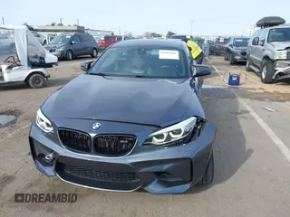 2018 BMW M2 with VIN WBS1J5C50JVE51869, listed as a IAAI auction lot 41814404 with 69,684 mi miles. Bid and sale history available at carsss.com. Image 6.